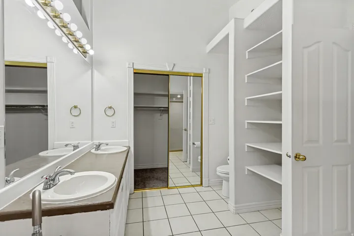 Dual vanity featuring individual sinks and chrome fixtures