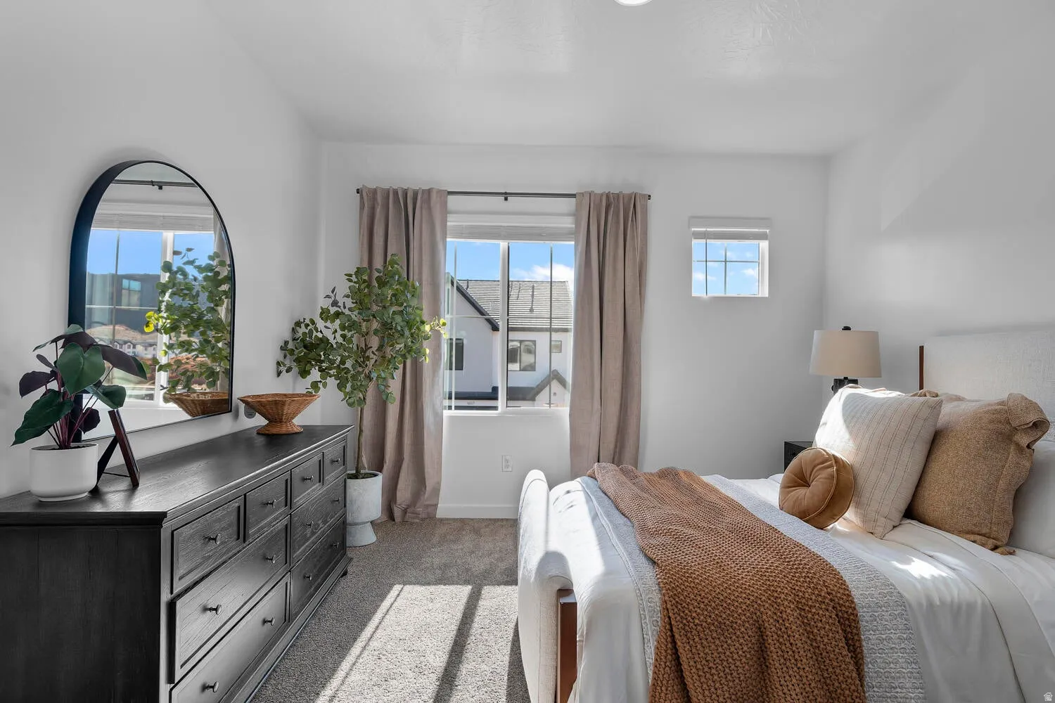 Carpeted flooring, recessed lighting, and multiple windows