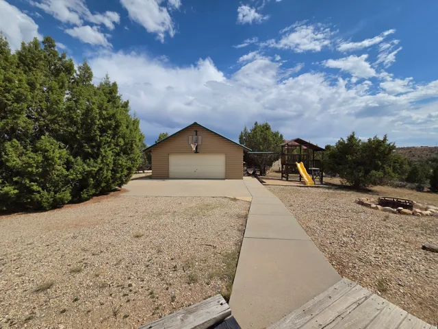 Attached two-car garage with a basketball hoop