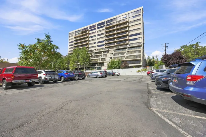 Expansive asphalt parking area with designated parking spaces