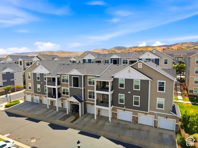 Modern multi-unit residential development featuring contemporary architectural design with mixed-tone exterior finishes in charcoal and neutral tones
