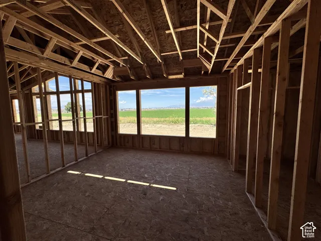 Interior framing with engineered wood subfloor and multiple large windows