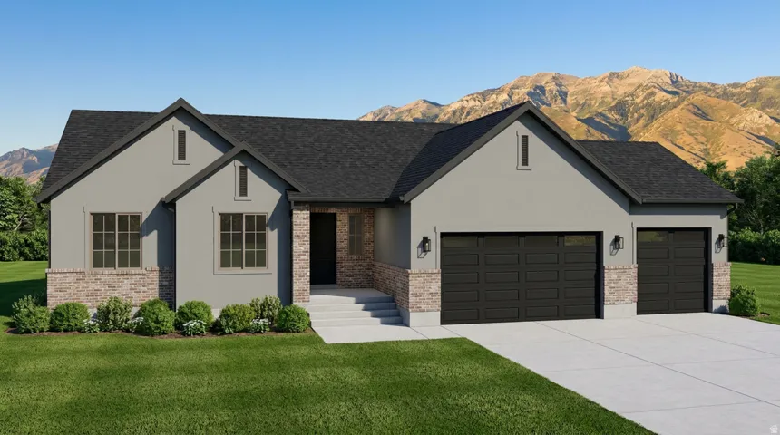 Contemporary exterior featuring light gray stucco and brick accents