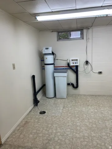 Water filtration system, floor drain, utility sink connection, window, and fluorescent lighting fixture