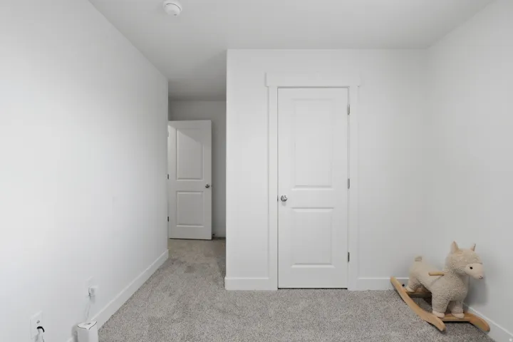 Textured carpet flooring and white walls