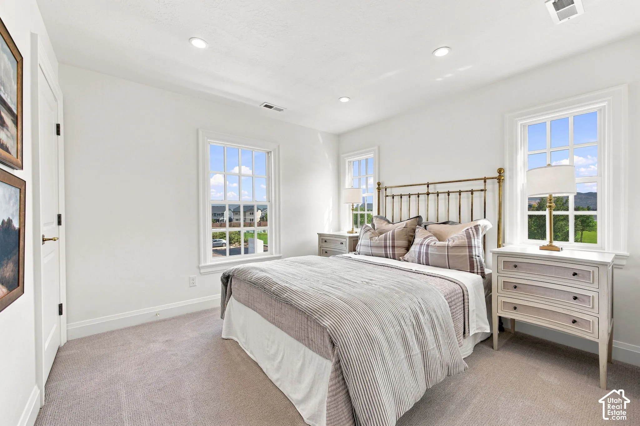 Model Home - Recessed ceiling lighting, white walls, two double-hung windows, and light-colored carpeting