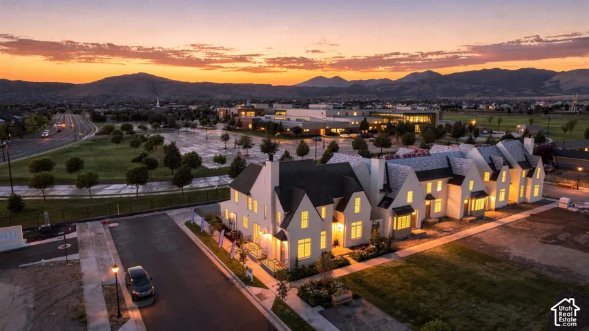 Modern townhome residences with white exteriors and dark roofing