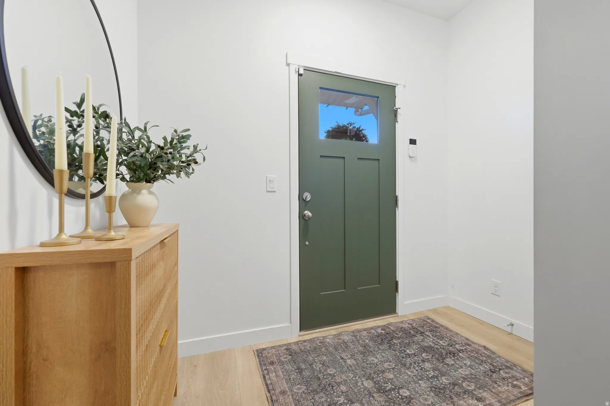Entry door with three-panel design and upper window