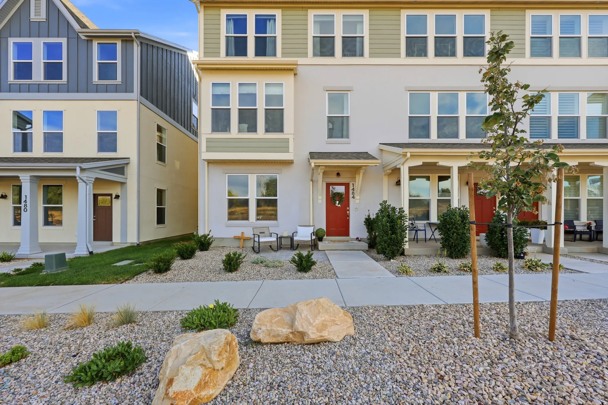 Multi-story stucco and siding exterior with multiple windows