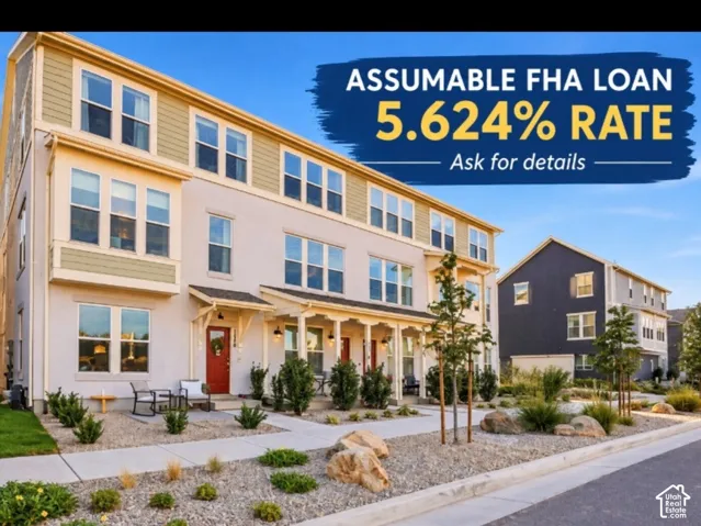 Three-story townhome with bay window, covered porch entry, and mixed material facade