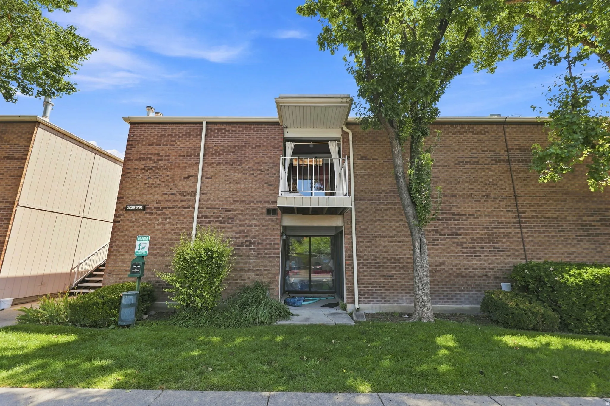 Brick exterior with a second-story balcony
