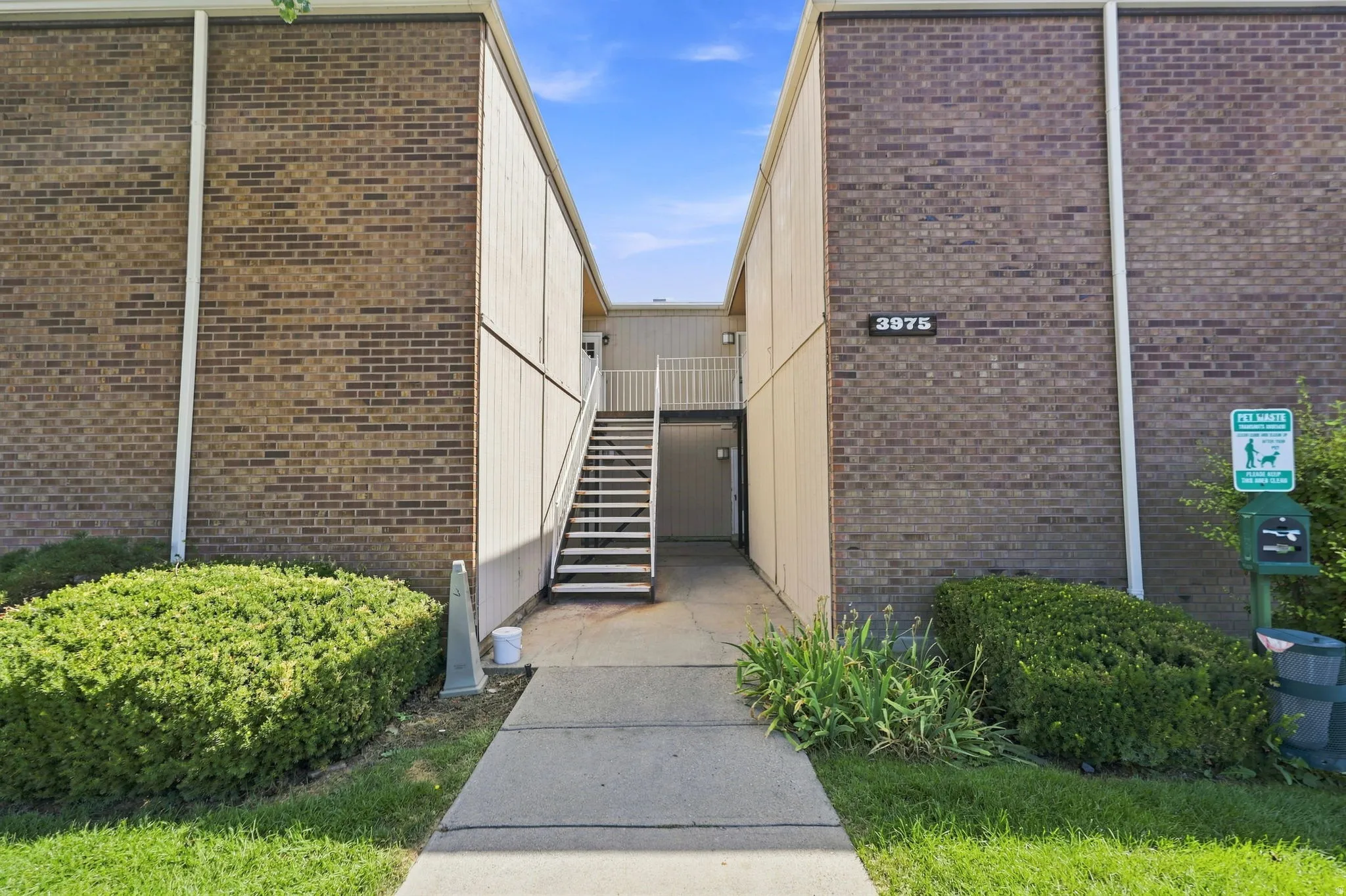 Brick exterior building with prominent address numbering