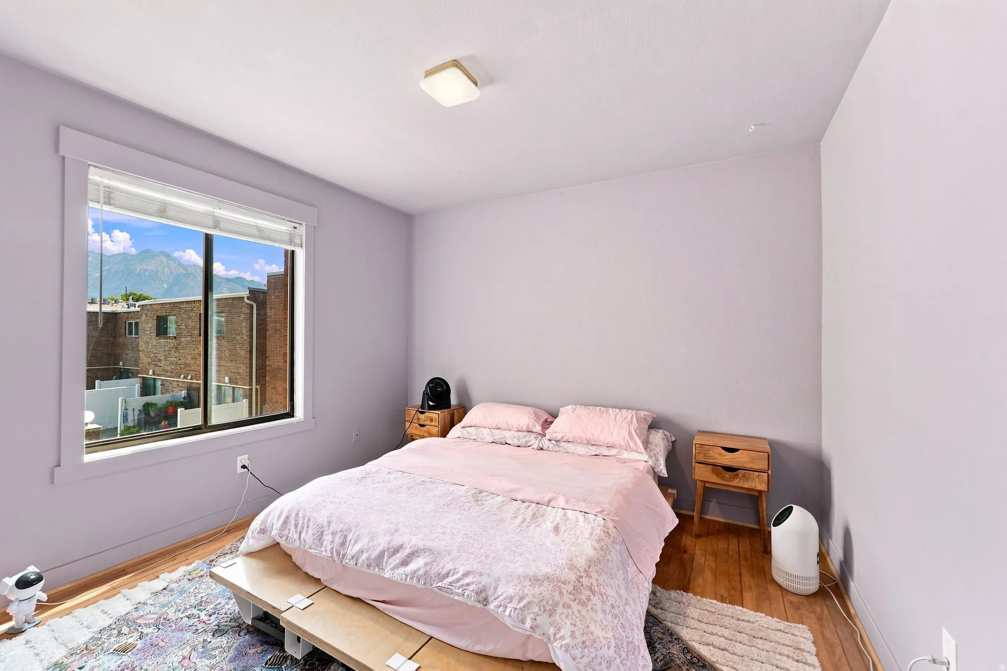Wood-finish flooring with a ceiling-mounted light fixture