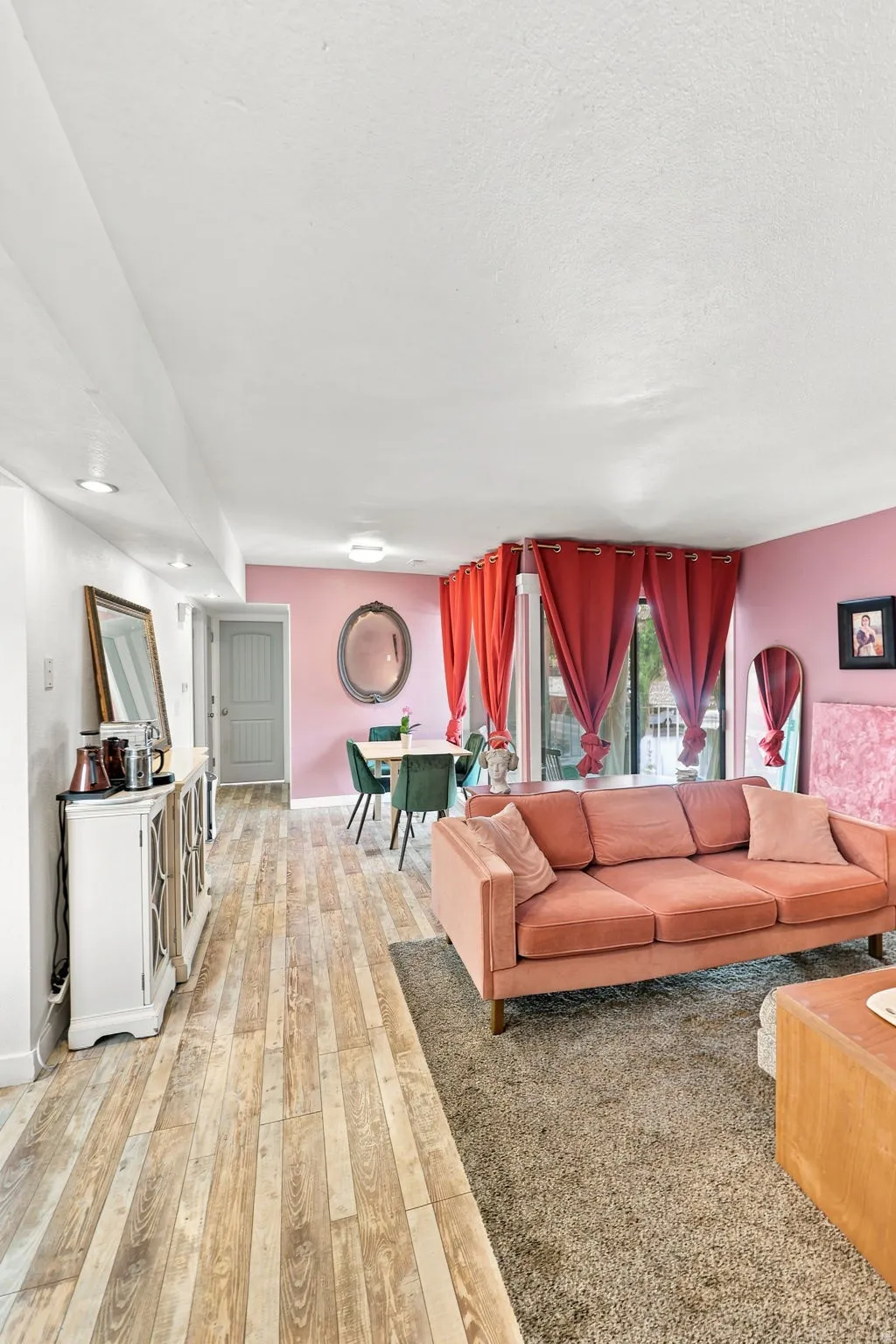 Wood-finish flooring throughout, complemented by recessed lighting and a ceiling-mounted light fixture