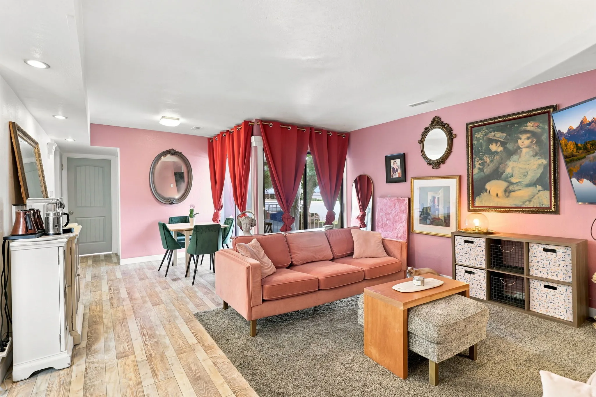 Wood-finish flooring, recessed lighting, built-in storage, and a dining area with a table and seating