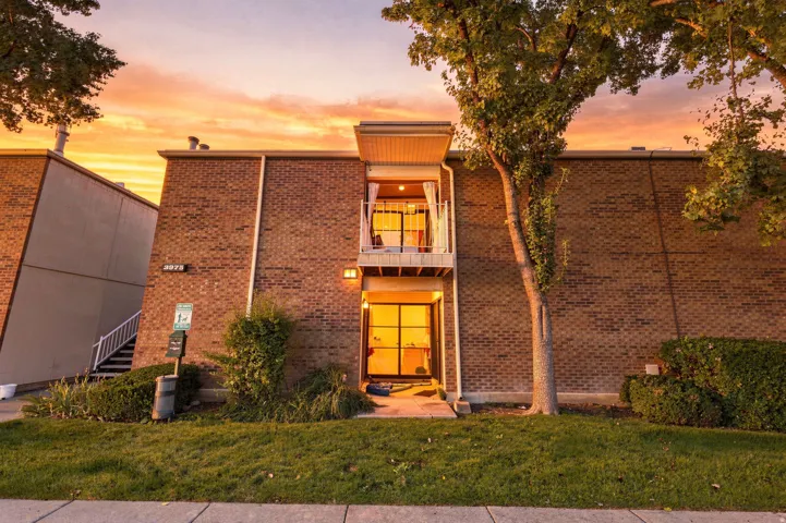 Brick exterior with a second-story balcony