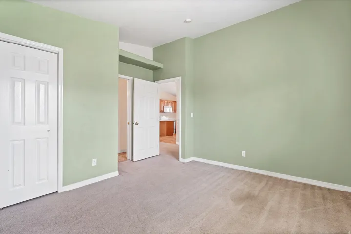 Wall-to-wall carpeting and white trim