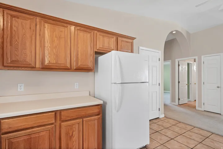 Wood-finish cabinetry paired with light-toned countertops