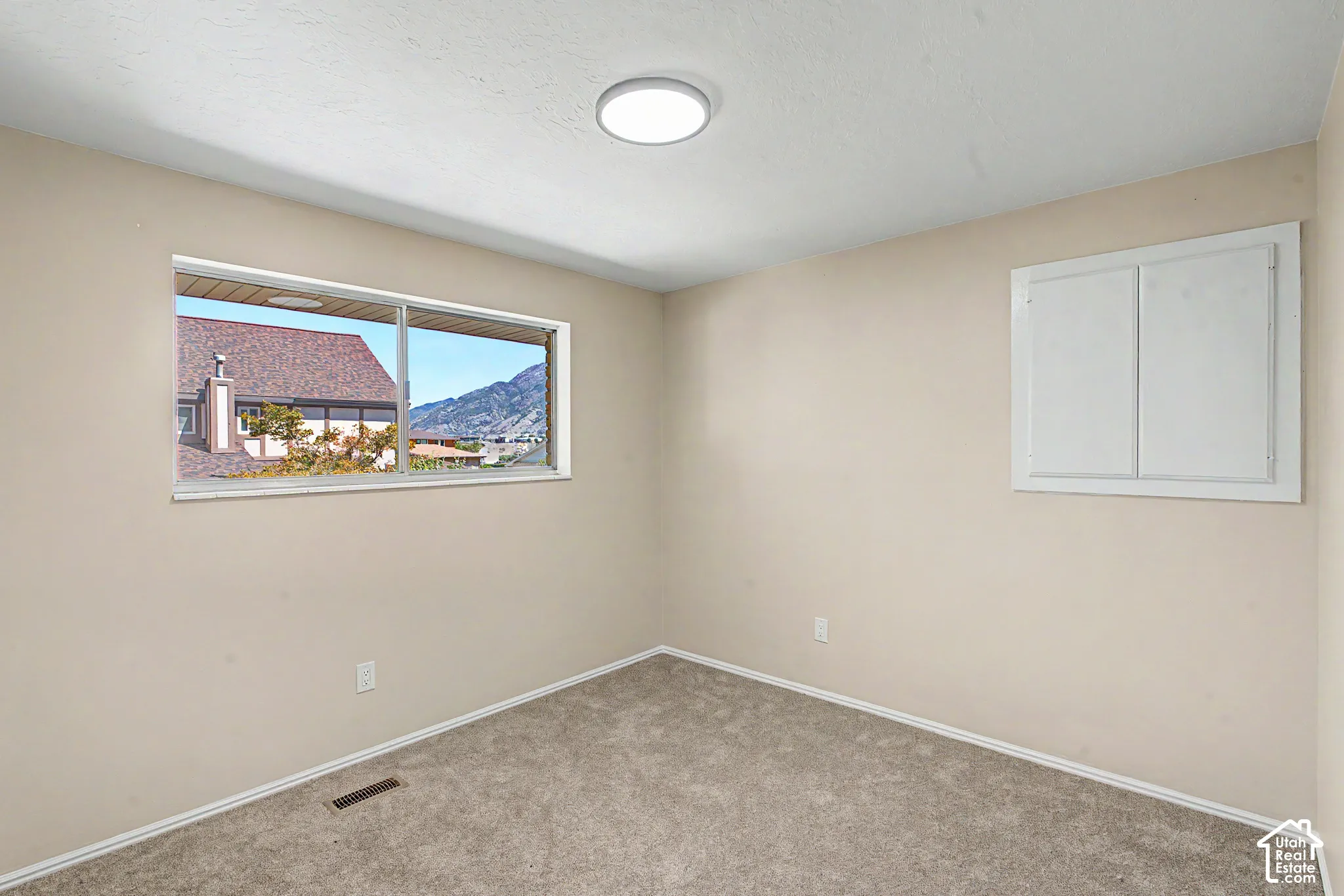 Bedroom 3 window view looking to Big Cottonwood Canyon and Brihton HS.