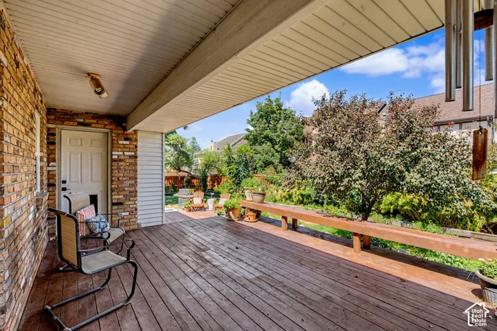 Covered patio with wood-finish decking, and built-in bench seating