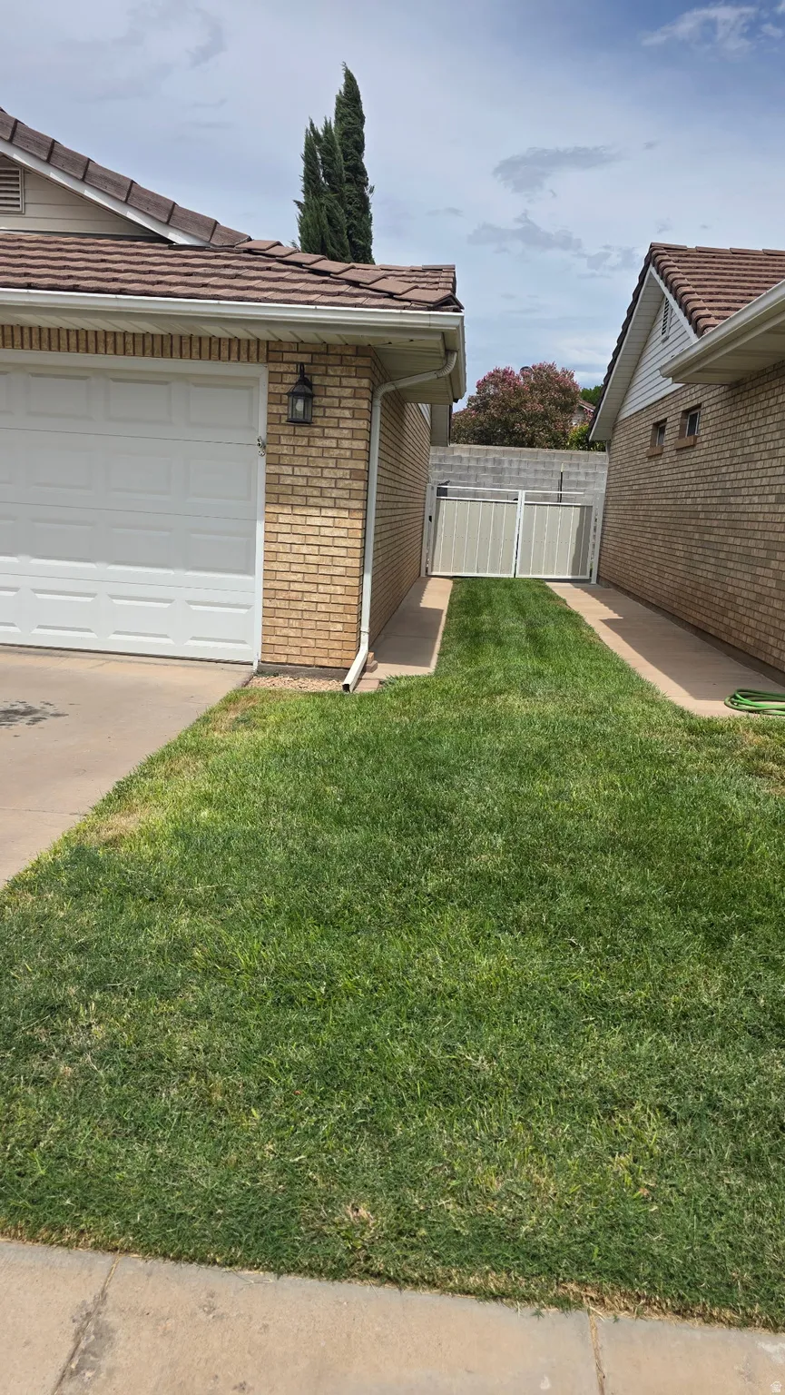 Attached garage with a white sectional door