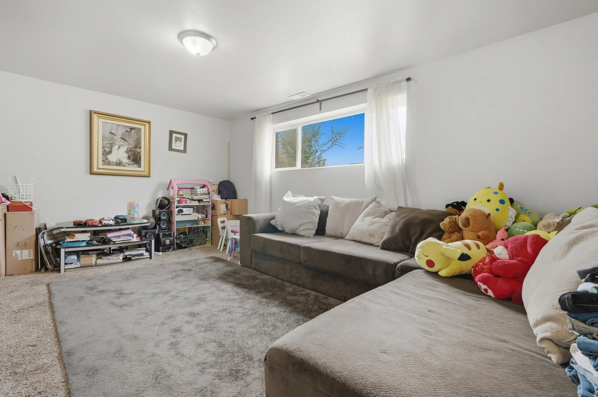 Recessed window with white trim, light-colored walls, and carpeted flooring