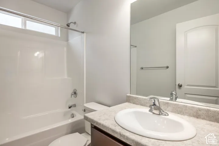 Integrated shower and tub unit with chrome fixtures and an overhead window