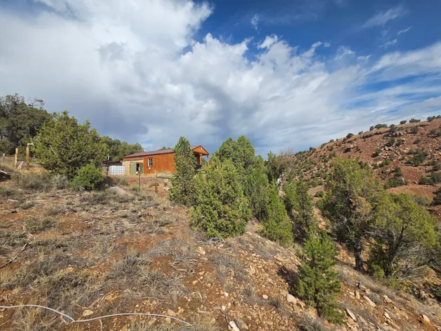 Spectacular mountain property with a creek & small off grid cabin/shed!