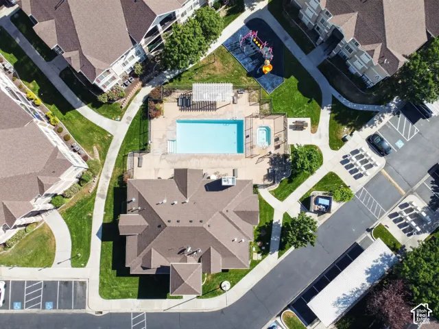 Community amenities featuring a swimming pool, hot tub, and playground