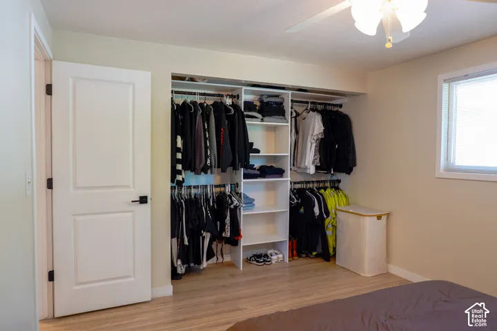 Built-in closet system with shelving and hanging rods