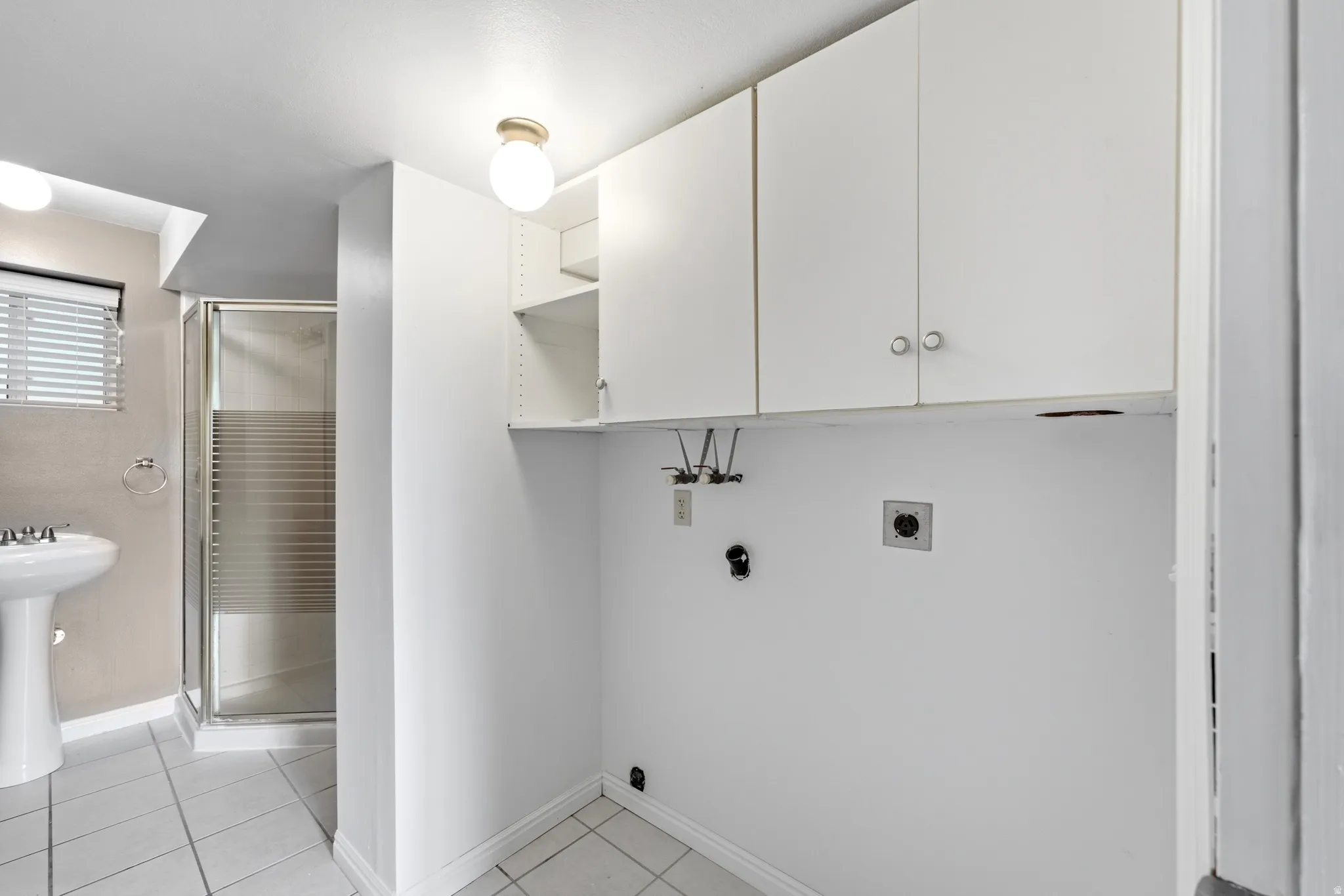 White wall-mounted cabinetry with storage shelves
