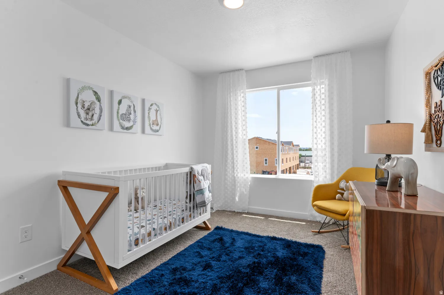 Bright room with carpet flooring and a large window