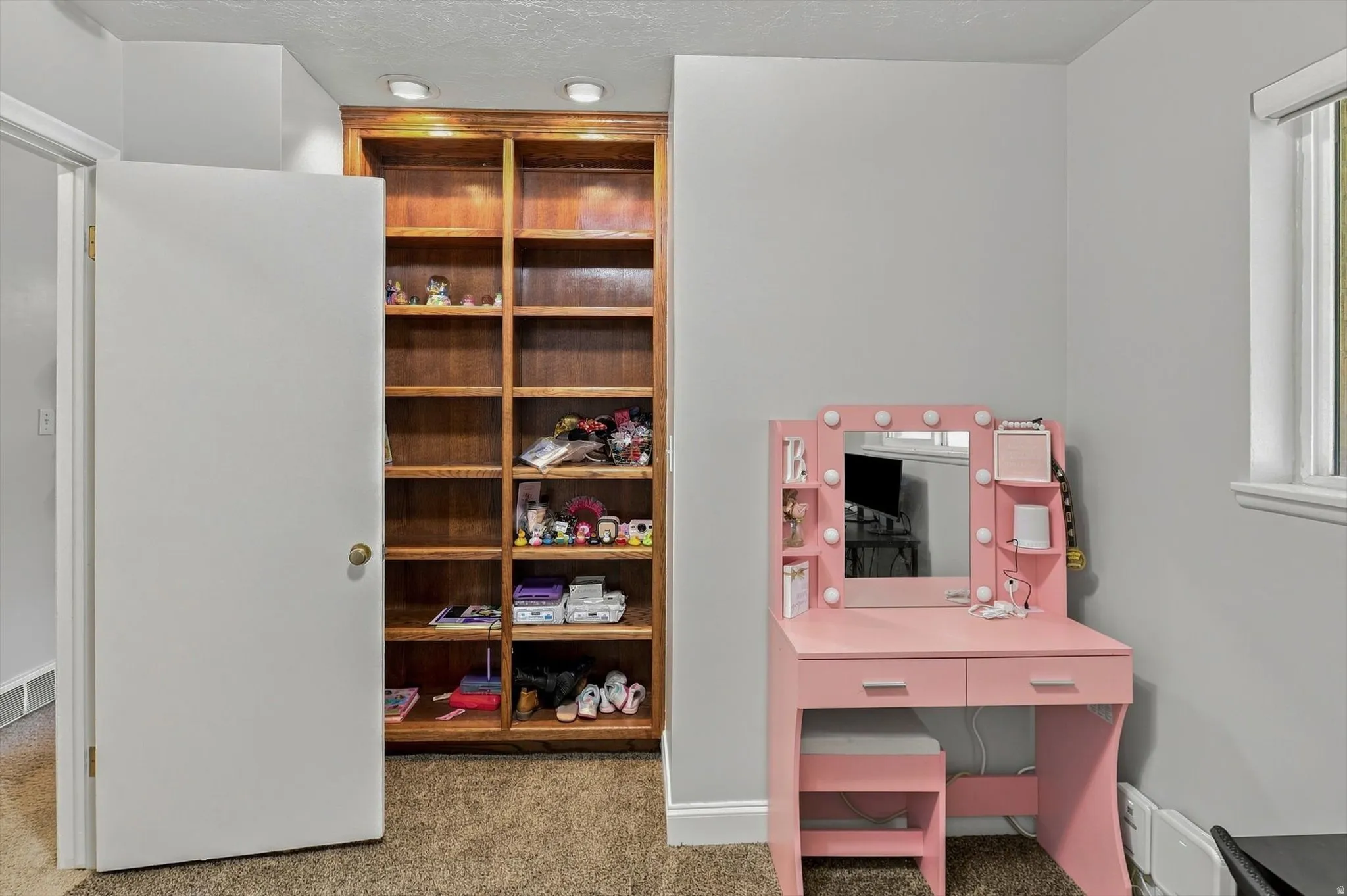 Bedroom 2 with built-in shelving unit