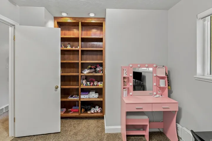 Bedroom 2 with built-in shelving unit