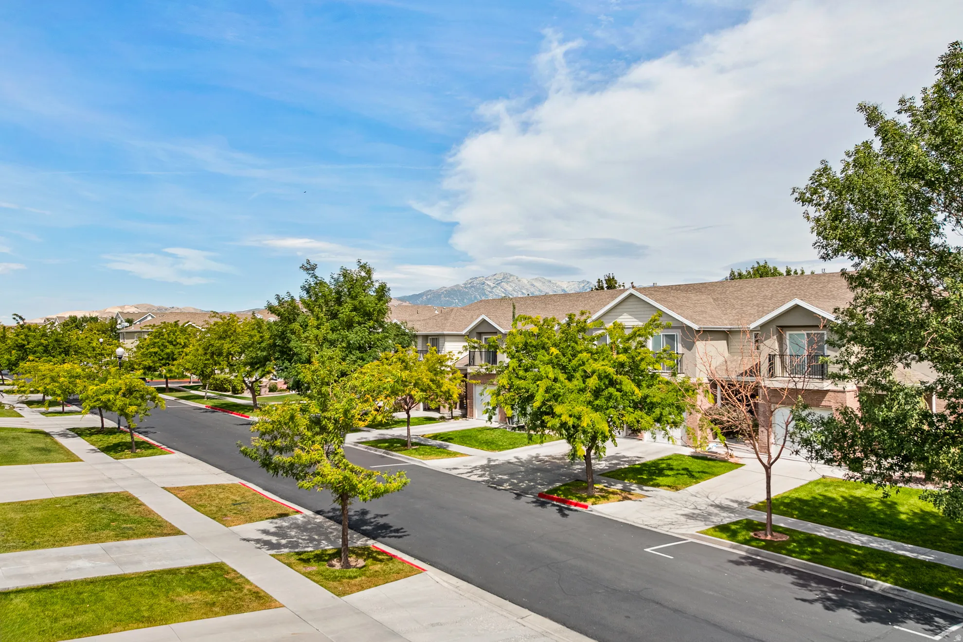 Townhome-style residences with attached garages and balconies