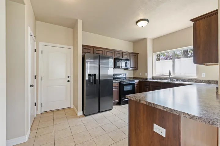 Tile Floors in Kitchen, Bathrooms and Entry.