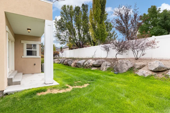 Open Green Space. Maintained by HOA. Southwest Corner of Home.