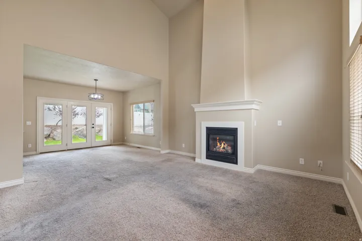 $10,000. CARPET ALLOWANCE. Living Room, Vaulter Ceilings, Fireplace, Dining Area.