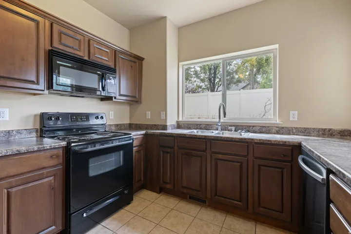 Range, Microwave, Dishwasher, & Fridge, all included.