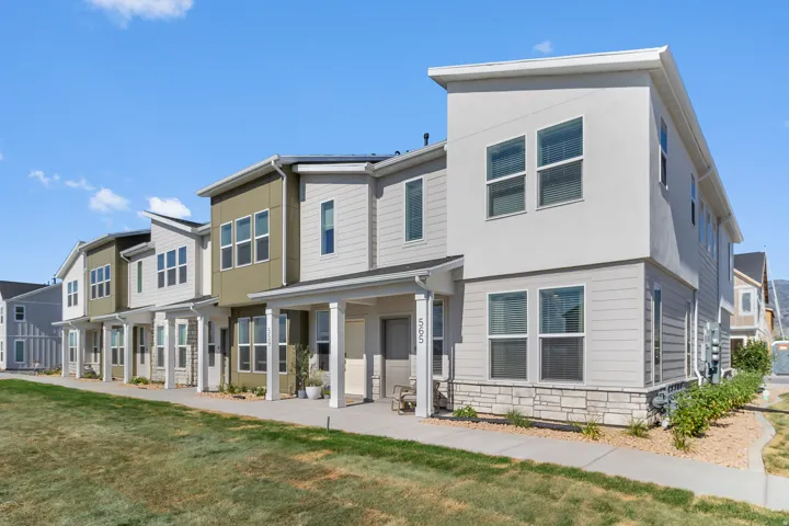 Contemporary multi-story facade featuring horizontal siding and stucco accents
