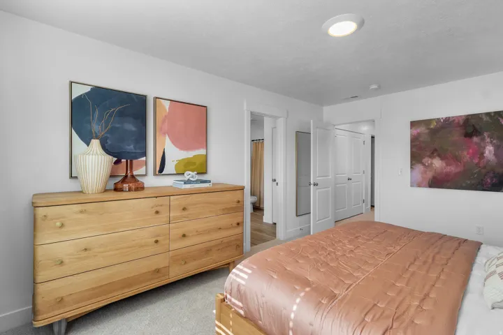 Recessed ceiling lighting, white interior walls, and carpet flooring