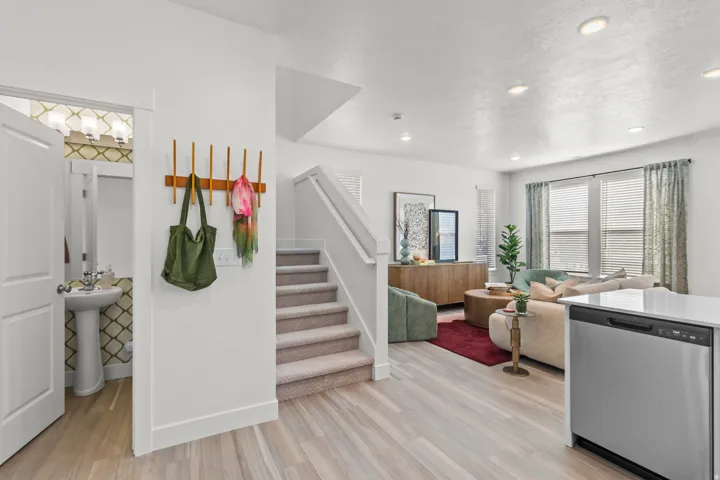 Open concept living area featuring wood-finish flooring and recessed lighting