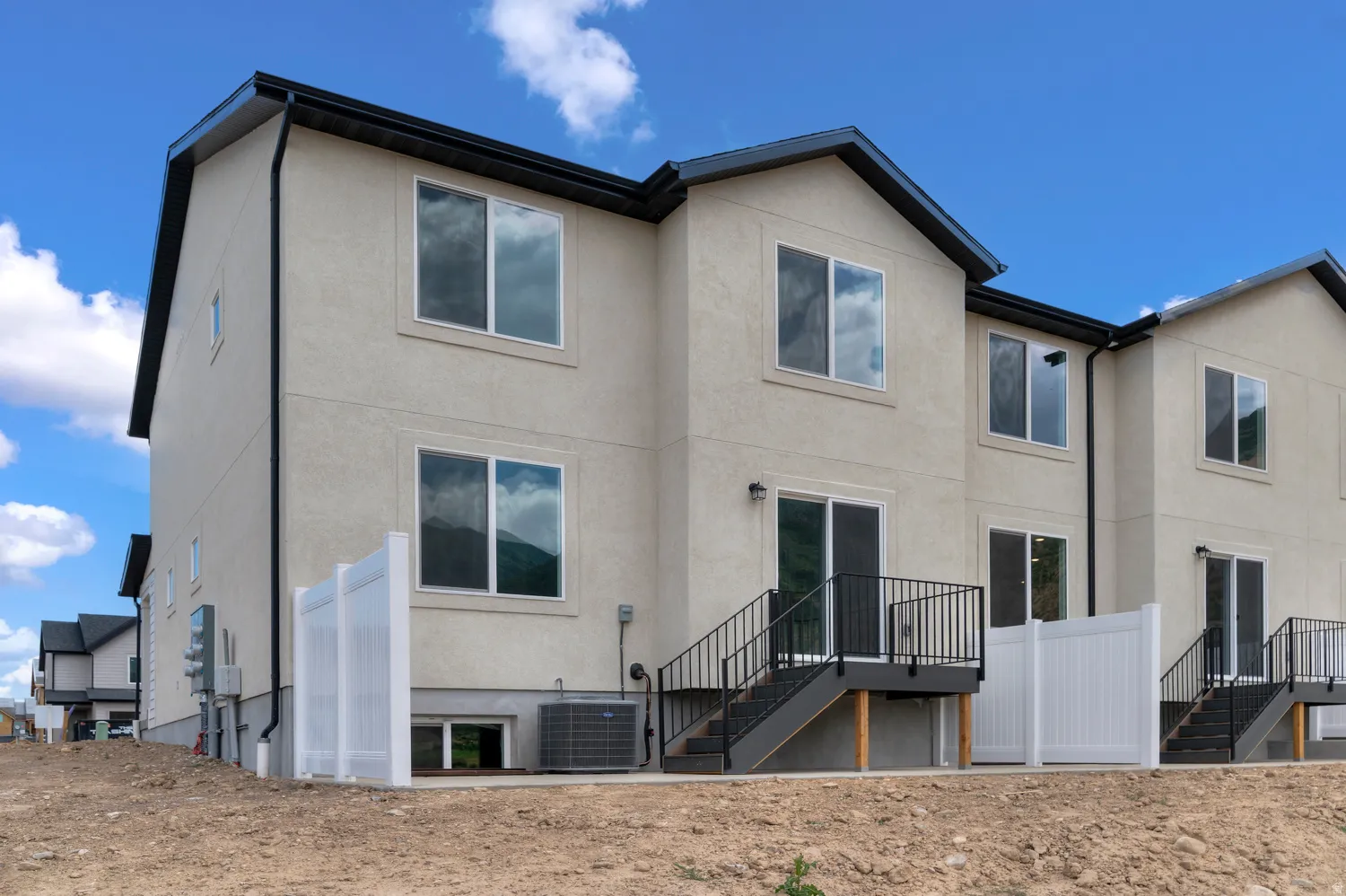 Stucco exterior with multiple windows