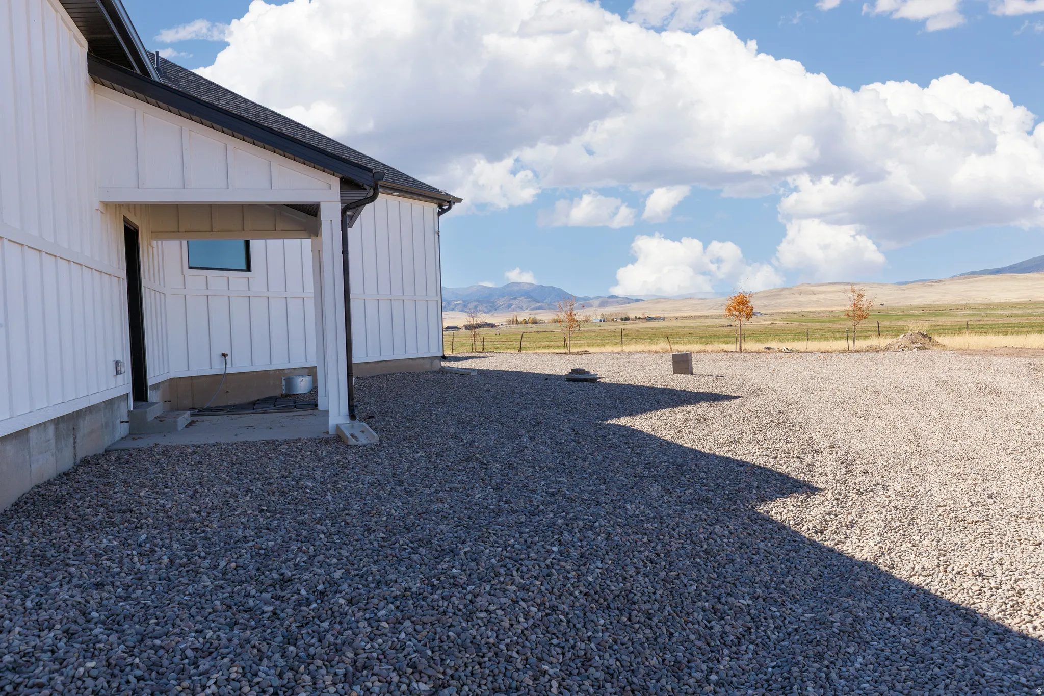 Board and batten exterior with a covered entry