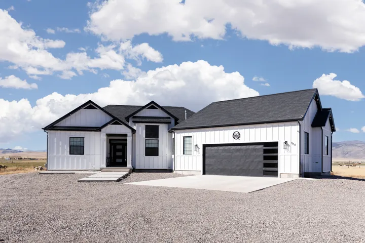Modern farmhouse exterior with white board-and-batten siding