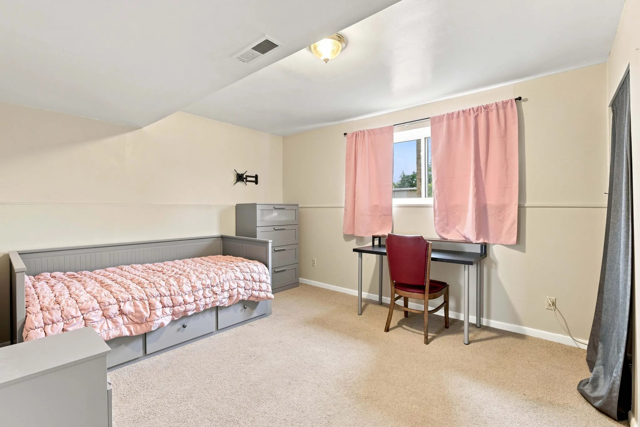 Window with natural light, wall-to-wall carpeting, and neutral wall tones