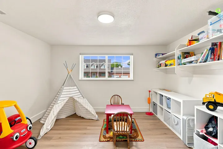 Playroom, extra space adjacent to the lower family room.