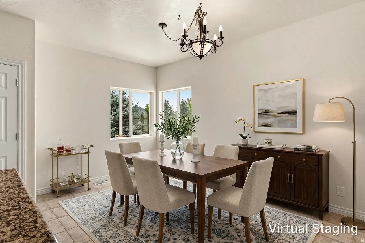 Tile flooring, vaulted ceiling, two windows, and a chandelier