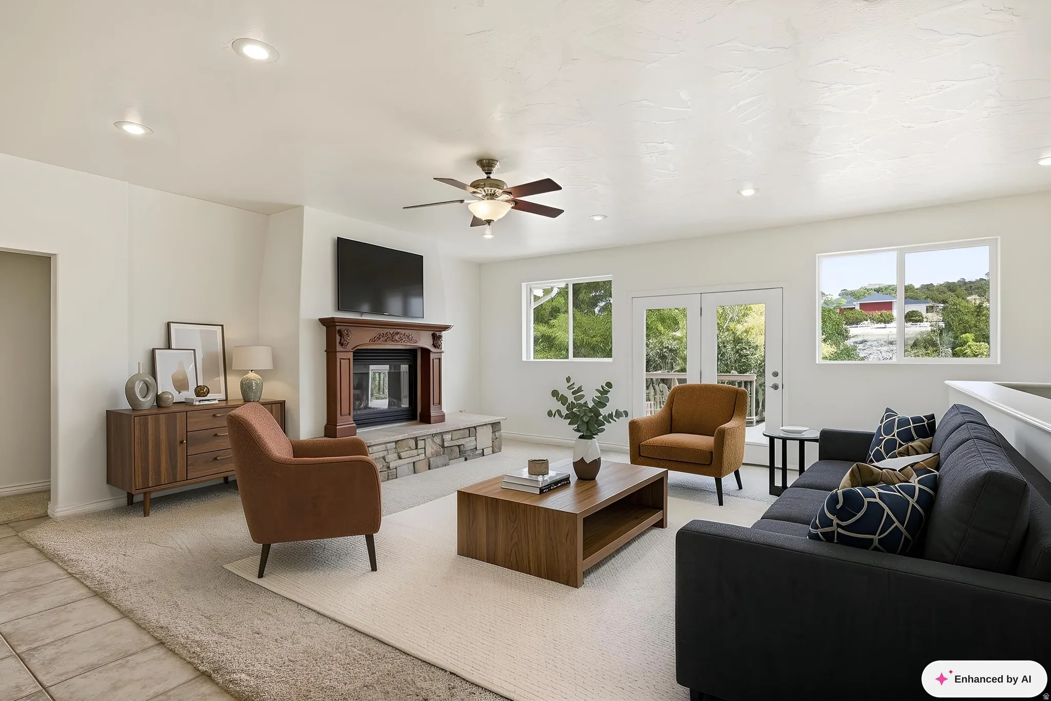 Living area featuring a stone-faced fireplace with a wood mantel, a ceiling fan, and recessed lighting