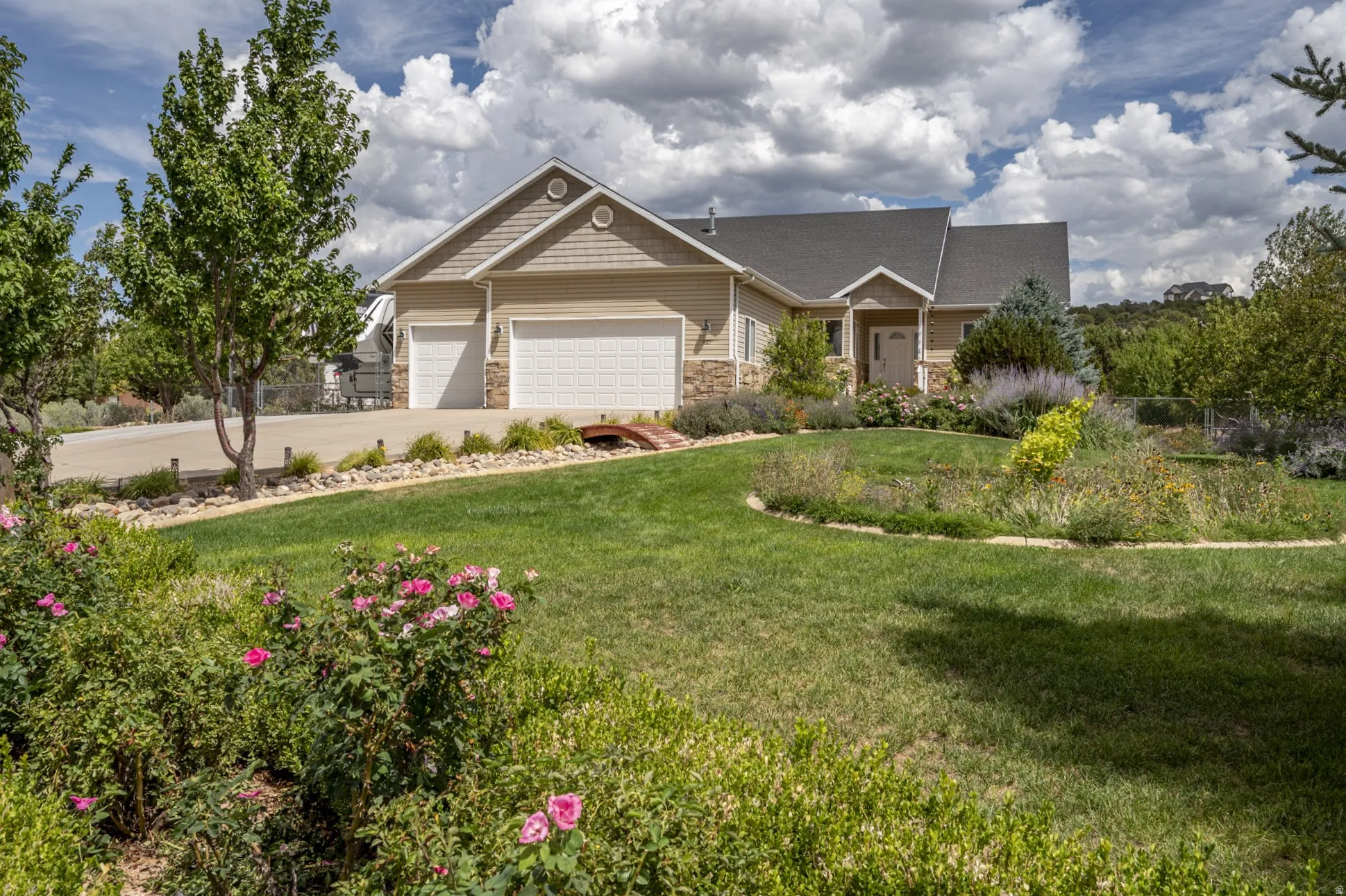 Exterior featuring horizontal siding and stone veneer